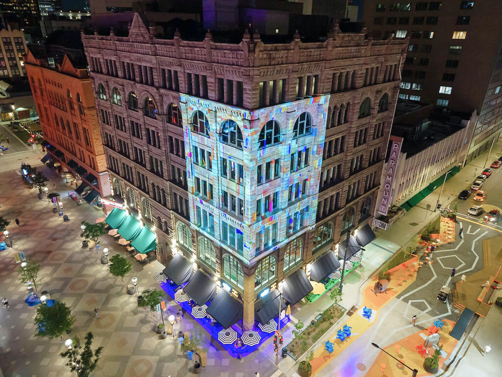 Artwork projection displayed on the architecture of the Kittredge Building in downtown Denver.