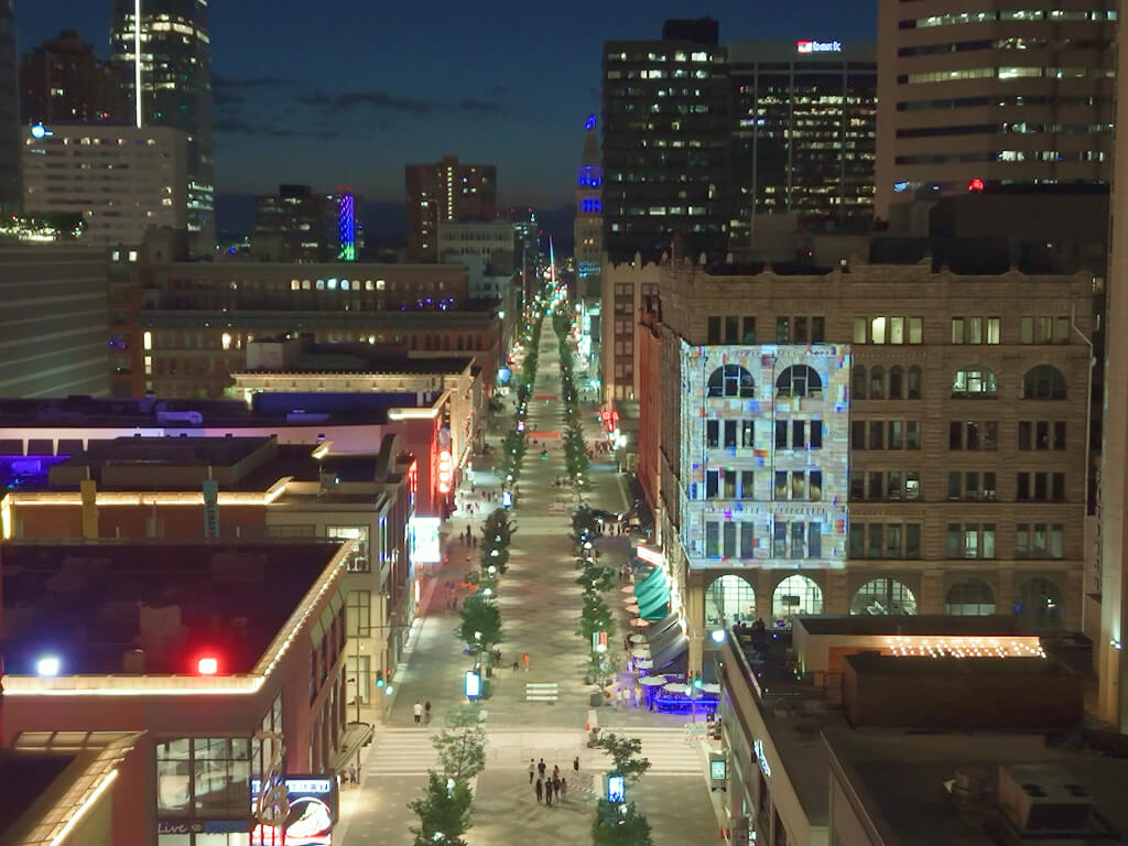 Artwork projection displayed on the architecture of the Kittredge Building in downtown Denver