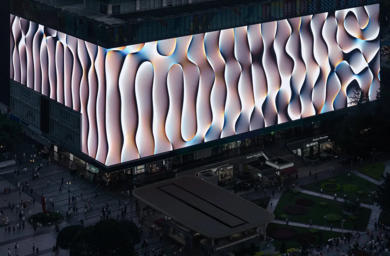 Aerial shot of the 'Lightscales' artwork displayed on a large screen in a plaza in Chongqing, China.