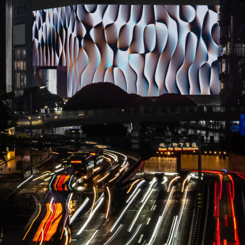 Lightscales displayed on a massive screen in Chongqing, China.