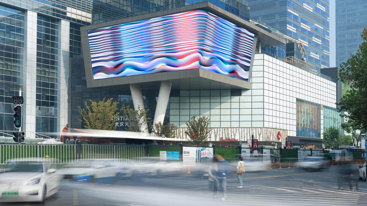 Artwork projection on a screen in Wuhan Xintiandi during daylight.