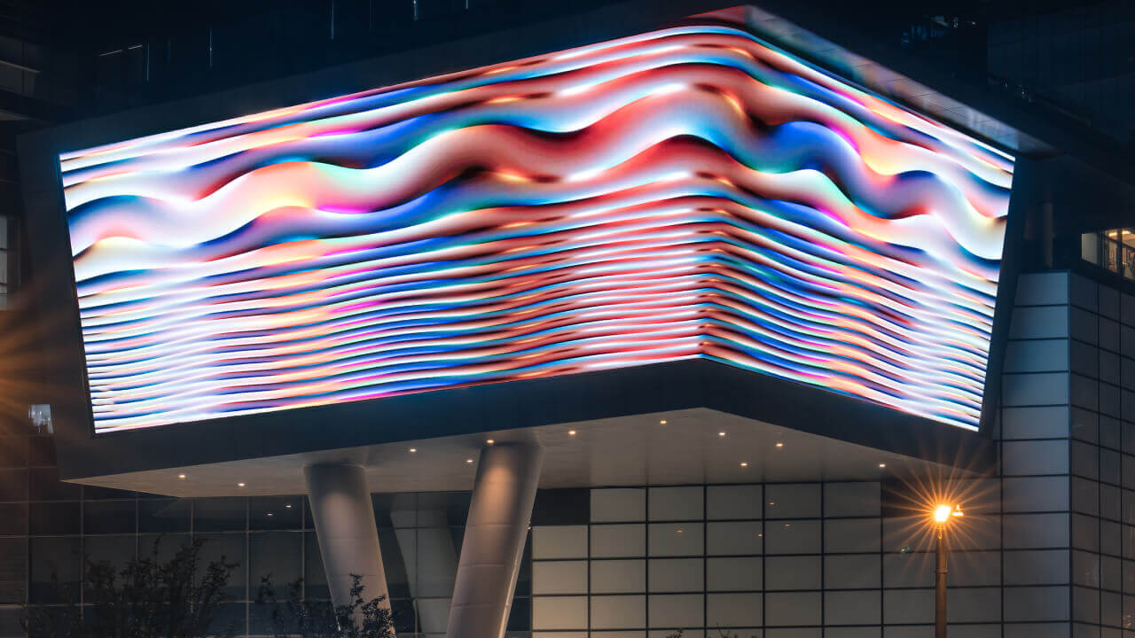 Close-up of artwork projection on a screen in Wuhan Xintiandi at night.