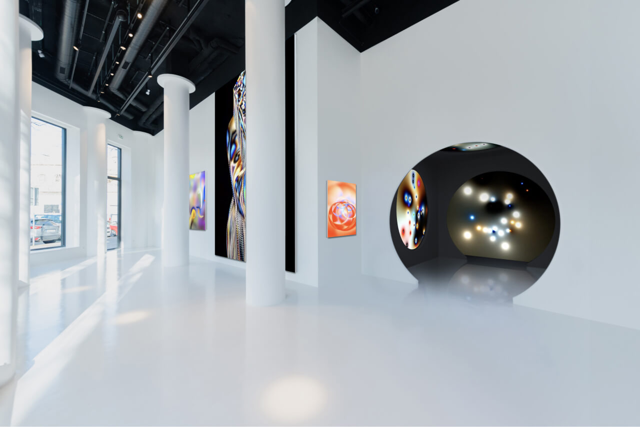 White gallery space with LED screens, highlighting with minimalist displays the artist's work.