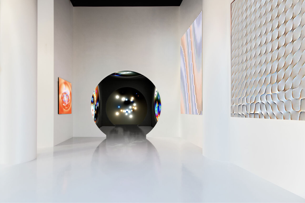 Another angle of the white gallery showcasing the artist's work on LED screens, with a spacious, open feel.